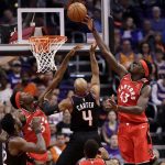 Toronto Raptors forward Pascal Siakam (43) blocks the shot of Phoenix Suns guard Jevon Carter (4) during the first half of an NBA basketball game Tuesday, March 3, 2020, in Phoenix.(AP Photo/Matt York)