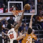Portland Trail Blazers center Hassan Whiteside (21) blocks the shot of Phoenix Suns forward Dario Saric (20) during the first half of an NBA basketball game Friday, March 6, 2020, in Phoenix. (AP Photo/Ross D. Franklin)