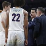 Arizona head coach Sean Miller speaks with his players during the second half of an NCAA college basketball game against Washington in the first round of the Pac-12 men's tournament Wednesday, March 11, 2020, in Las Vegas. (AP Photo/John Locher)