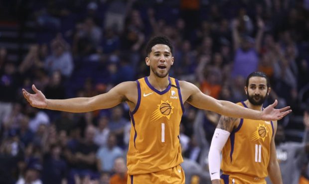 Phoenix Suns guard Devin Booker (1) celebrates a 3-pointer against the Portland Trail Blazers by Su...
