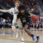 Washington's Marcus Tsohonis (15) drives around Arizona's Nico Mannion during the first half of an NCAA college basketball game in the first round of the Pac-12 men's tournament Wednesday, March 11, 2020, in Las Vegas. (AP Photo/John Locher)