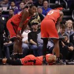 Toronto Raptors guard Kyle Lowry lies on the court after being injured during the first half of an NBA basketball game against the Phoenix Suns Tuesday, March 3, 2020, in Phoenix. Lowry left the game. (AP Photo/Matt York)