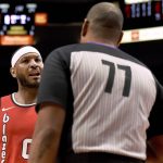 
              Portland Trail Blazers forward Carmelo Anthony, left, has some words with referee Karl Lane, right, during the first quarter of the team's NBA basketball game against the Phoenix Suns in Portland, Ore., Tuesday, March 10, 2020. (AP Photo/Steve Dykes)
            