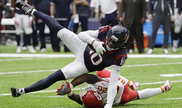 Houston Texans wide receiver DeAndre Hopkins (10) is upended by Kansas City Chiefs cornerback Steve...
