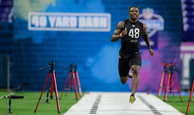 Alabama wide receiver Henry Ruggs III runs the 40-yard dash at the NFL football scouting combine in...