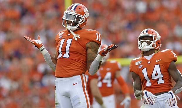 Clemson's Isaiah Simmons (11) and Denzel Johnson react after making a defensive play during the fir...