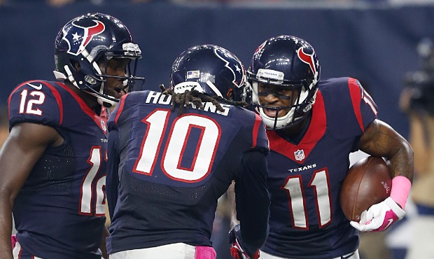 Keith Mumphery #12 and DeAndre Hopkins #10 celebrate Jaelen Strong #11 of the Houston Texans agains...