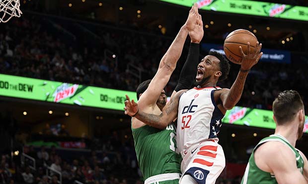 Washington Wizards guard Jordan McRae (52) goes to the basket next to Boston Celtics center Enes Ka...