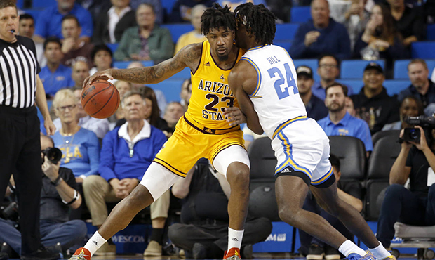 Arizona State forward Romello White (23) is defended by UCLA forward Jalen Hill (24) during the fir...