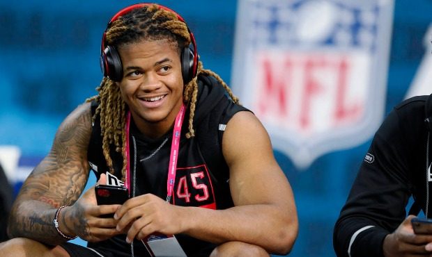 Ohio State defensive lineman Chase Young watches a drill at the NFL football scouting combine in In...