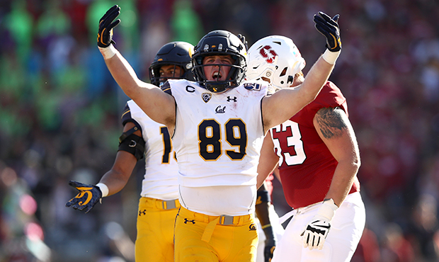 Evan Weaver #89 of the California Golden Bears reacts after he tackled Cameron Scarlett #22 of the ...