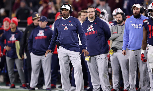 Head coach Kevin Sumlin of the Arizona Wildcats watches from the sidelines during the second half o...