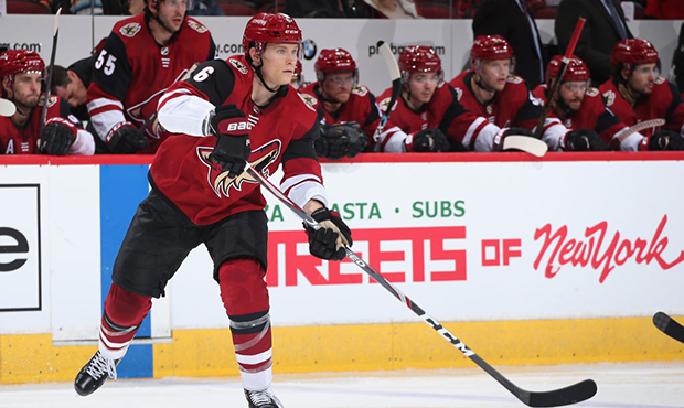 Jakob Chychrun #6 of the Arizona Coyotes passes the puck during the third period of the NHL game ag...
