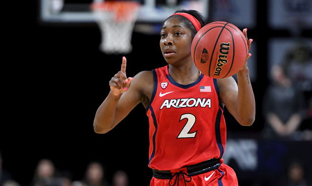 Aarion McDonald #2 of the Arizona Wildcats sets up a play against the Oregon Ducks during the Pac-1...