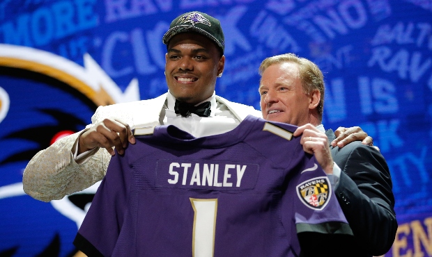 Ronnie Stanley of Notre Dame holds up a jersey with NFL Commissioner Roger Goodell after being pick...