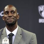 FILE - In this July 18, 2013 file photo, Kevin Garnett smiles as he speaks to reporters during an NBA basketball news conference in New York.  Garnett and fellow NBA greats Tim Duncan and Kobe Bryant headlined a nine-person group announced Saturday, April 4, 2020,  as this year's class of enshrinees into the Naismith Memorial Basketball Hall of Fame. They all got into the Hall in their first year of eligibility, as did WNBA great Tamika Catchings. Two-time NBA champion coach Rudy Tomjanovich, longtime Baylor women's coach Kim Mulkey, 1,000-game winner Barbara Stevens of Bentley and three-time Final Four coach Eddie Sutton were selected. So was former FIBA Secretary General Patrick Baumann. (AP Photo/Mary Altaffer, File)