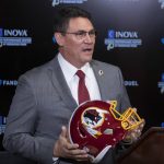 FILE - In this Jan. 2, 2020, file photo, Washington Redskins new head coach Ron Rivera holds up a helmet during a news conference at the team's NFL football training facility in Ashburn, Va. The NFL Draft is April 23-25. (AP Photo/Alex Brandon, File)