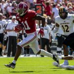 FILE - In this Sept. 21, 2019, file photo, Alabama wide receiver Henry Ruggs (11) runs in for a touchdown on a pass reception against Southern Mississippi during the first half of an NCAA college football game in Tuscaloosa, Ala.  The Raiders have the 12th and 19th picks in the NFL draft thanks to the 2018 trade that sent star pass rusher Khalil Mack to the Chicago Bears. Several receivers are projected to go in the first round. Ruggs and Oklahoma's CeeDee Lamb are considered by many analysts to be the best of the bunch. (AP Photo/Vasha Hunt, File)
