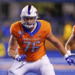 FILE - In this Oct. 12, 2019, file photo, Boise State offensive lineman Ezra Cleveland (76) is shown during the first half of an NCAA college football game against Hawaii in Boise, Idaho. Cleveland is a possible pick in the NFL Draft which runs Thursday, April 23, 2020, thru Saturday, April 25. (AP Photo/Steve Conner, File)