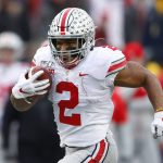 FILE - In this Nov. 30, 2019, file photo, Ohio State running back J.K. Dobbins runs for a 33-yard touchdown against Michigan in the second half of an NCAA college football game, in Ann Arbor, Mich. Dobbins is a possible pick in the NFL Draft which runs Thursday, April 23, 2020, thru Saturday, April 25. (AP Photo/Paul Sancya, File)