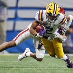 FILE - In this Dec. 28, 2019, file photo, LSU wide receiver Justin Jefferson (2) runs against Oklahoma cornerback Woodi Washington (5) during the second half of the Peach Bowl NCAA semifinal college football playoff game in Atlanta. This year's NFL draft features a superb group of wide receivers, including Jefferson, who are expected to make immediate impacts in the NFL.(AP Photo/John Bazemore, File)
