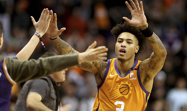 Phoenix Suns' Kelly Oubre Jr. (3) celebrate with fans after coming back late in an NBA basketball g...