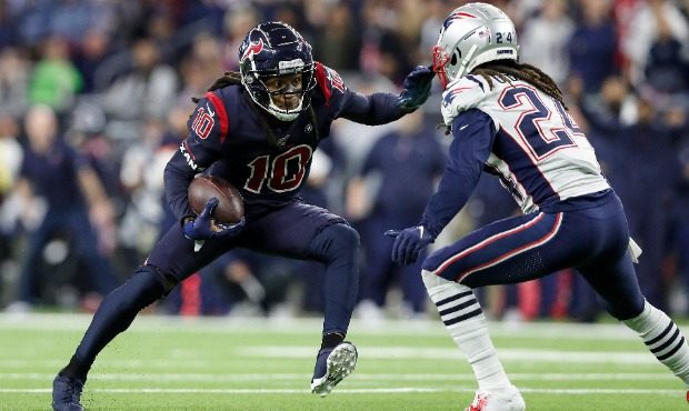 DeAndre Hopkins #10 of the Houston Texans runs after a reception in the fourth quarter defended by ...