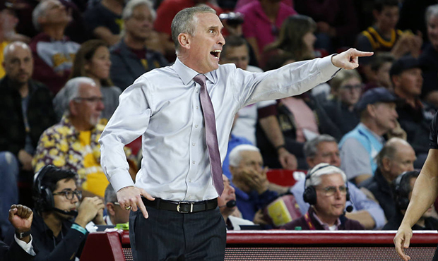 Arizona State coach Bobby Hurley, left, argues a call during the first half of the team's NCAA coll...
