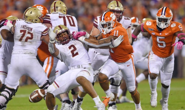 Clemson's Isaiah Simmons (11) tackles AJ Dillon (2), causing a fumble, during the first half of an ...