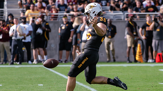 Arizona State Sun Devils punter Michael Turk (35) punts the ball during the college football game b...
