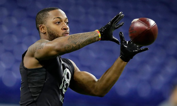 Memphis wide receiver Antonio Gibson runs a drill at the NFL football scouting combine in Indianapo...