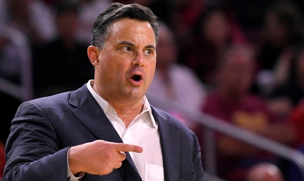 Arizona head coach Sean Miller gestures to his team during the first half of an NCAA college basket...