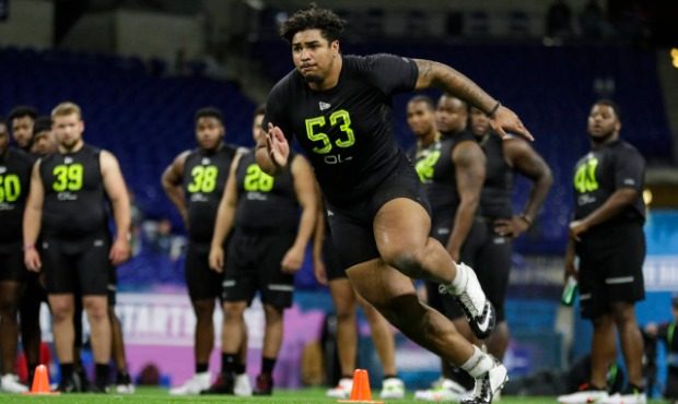 Iowa offensive lineman Tristan Wirfs runs a drill at the NFL football scouting combine in Indianapo...