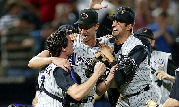 Arizona's #51 Randy Johnson is swarmed by teammates after pitching a perfect game against the Atlan...