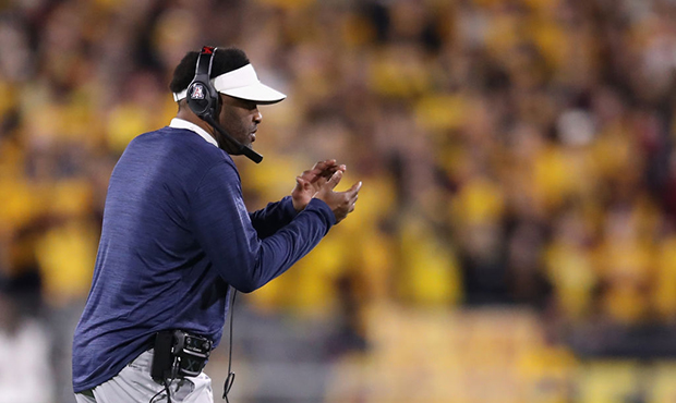 Head coach Kevin Sumlin of the Arizona Wildcats watches from the sidelines during the first half of...