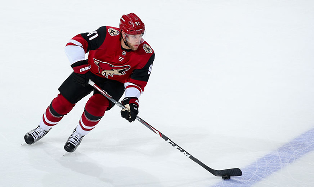 Taylor Hall #91 of the Arizona Coyotes skates with the puck during the first period of the NHL game...