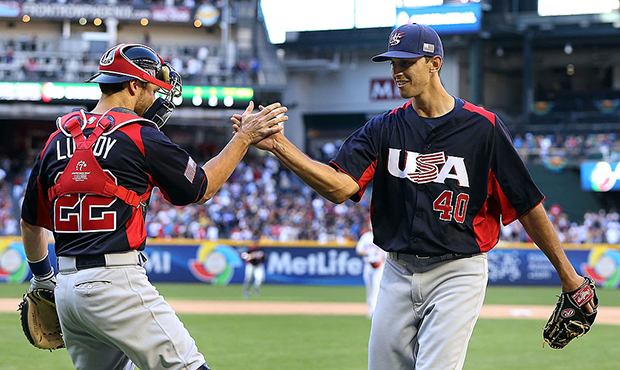 Relief pitcher Steve Cishek #40 of USA celebrates with catcher Jonathan Lucroy #22 after getting ou...