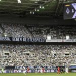 A banner reading "For Borussia, against ghost matches" is displayed during the German Bundesliga soccer match between Borussia Moenchengladbach and Leverkusen, in Moenchengladbach, Germany, Saturday, May 23, 2020. (Ina Fassbender Pool Photo via AP)