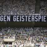A banner reading "against ghost matches" is pictured aheadthe German first division Bundesliga football match Borussia Moenchengladbach and Bayer 04 Leverkusen on Saturday, May 23, 2020 in Moenchengladbach, western Germany. (Ina Fassbender/pool via AP)