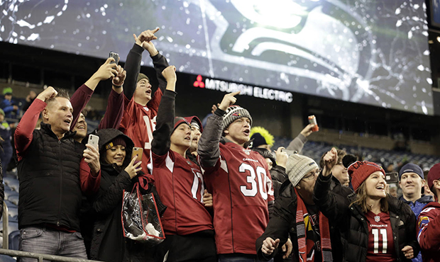 Arizona Cardinals fans cheer after the team defeated the Seattle Seahawks in an NFL football game, ...