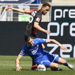 Hoffenheim's Austrian midfielder Florian Grillitsch (front) and Hertha Berlin's Brazilian forward Matheus Cunha vie for the ball during the Bundesliga soccer match between TSG 1899 Hoffenheim and Hertha BSC Berlin in Sinsheim, Germany, Saturday, May 16, 2020. The German Bundesliga becomes the world's first major soccer league to resume after a two-month suspension because of the coronavirus pandemic. (Thomas Kienzle/AFP pool via AP)