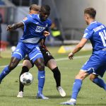 Hoffenheim's Togolese forward Ihlas Bebou, left, and Hertha's Slovakian defender Peter Pekarik  vie for the ball during the Bundesliga soccer match between TSG 1899 Hoffenheim and Hertha BSC Berlin in Sinsheim, Germany, Saturday, May 16, 2020. The German Bundesliga becomes the world's first major soccer league to resume after a two-month suspension because of the coronavirus pandemic. (Thomas Kienzle/AFP pool via AP)