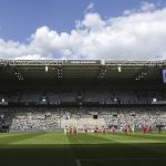 Players observe a minute of silence to commemorate the victims of coronavirus, prior to the German Bundesliga soccer match between Borussia Moenchengladbach and Leverkusen, in Moenchengladbach, Germany, Saturday, May 23, 2020. (Ina Fassbender Pool Photo via AP)