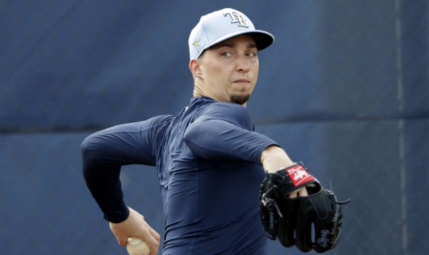 Tampa Bay Rays starting pitcher Blake Snell throws during spring training baseball camp Friday, Feb...