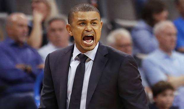 Phoenix Suns coach Earl Watson yells to his team during the second half of an NBA basketball game a...