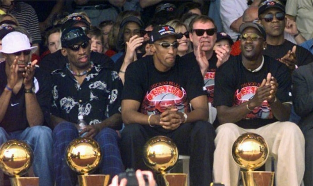 FILE - In this June 16, 1998, file photo, NBA Champions, from left: Ron Harper, Dennis Rodman, Scot...