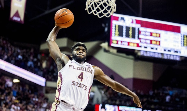 Florida State forward Patrick Williams (4) slams a dunk against Louisville in the second half of an...