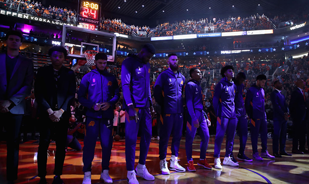 The Phoenix Suns stand attended for the national anthem before NBA game against the Sacramento King...