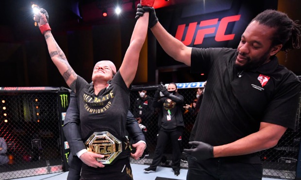 In this handout provided by UFC, Amanda Nunes of Brazil celebrates after her unanimous-decision vic...