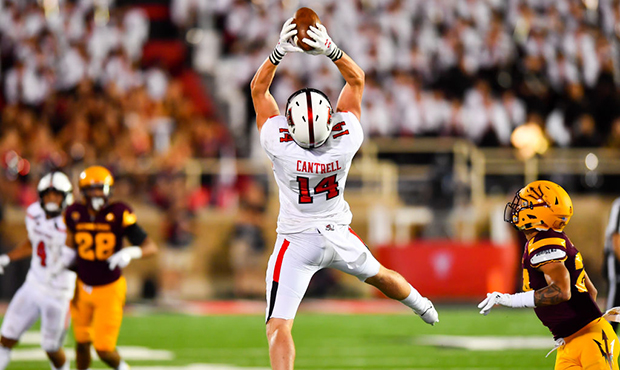 Dylan Cantrell #14 of the Texas Tech Red Raiders makes a leaping catch during the game against the ...